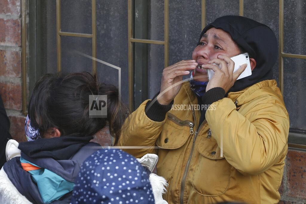 Ivan Valencia FILE - In this March 22, 2020 file photo, the relative of an inmate cries as she speaks on the phone outside La Modelo jail in Bogota, Colombia. Violence broke out in the prison out of inmates' fears that authorities are not doing enough to prevent coronavirus inside overcrowded prisons. (AP Photo/Ivan Valencia, File)