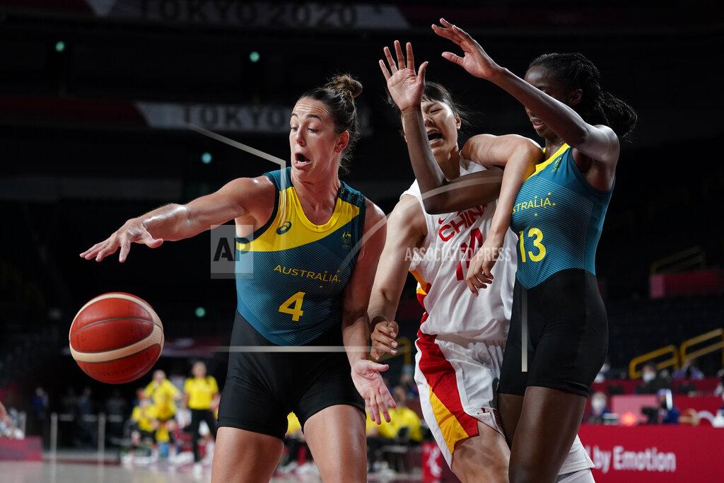 Charlie Neibergall Australia's Jenna O'Hea (4) and Ezi Magbegor (13) battle with China's Yueru Li (14) for loose ball during a women's basketball preliminary round game at the 2020 Summer Olympics in Saitama, Japan, Friday, July 30, 2021. (AP Photo/Charlie Neibergall)