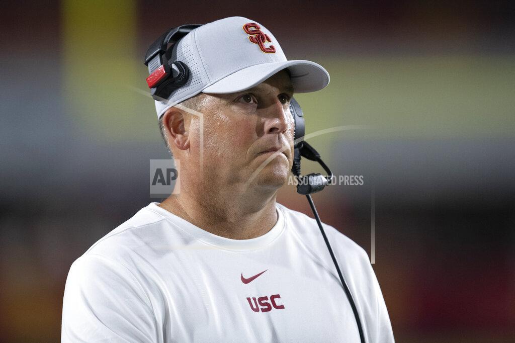 Kyusung Gong FILE - In this Sept. 31, 2019, file photo, Southern California head coach Clay Helton watches an NCAA college football game against Fresno State in Los Angeles. The Pac-12 has discussed the possibility of moving to an 11-game, all-conference schedule this year amid the unprecedented uncertainty of the coronavirus pandemic, Helton says. Stanford's David Shaw also says he does not necessarily agree with NCAA President Mark Emmert's belief that college campuses should be open for college sports to resume. (AP Photo/Kyusung Gong, File)