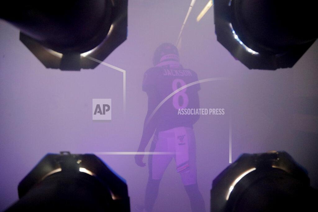 Julio Cortez Baltimore Ravens quarterback Lamar Jackson walks through a smoke-filled tunnel while being introduced onto the field prior to an NFL football game against the Cincinnati Bengals Sunday, Oct. 13, 2019, in Baltimore. (AP Photo/Julio Cortez)
