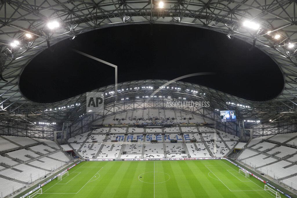 Claude Paris This photo taken on Oct.25, 2018 shows the the Velodrome stadium in Marseille, southern France. The first game of the French soccer season has been postponed because of an outbreak of COVID-19 cases at Marseille. The decision came shortly after Marseille confirmed three positive cases among its first-team players and staff. (AP Photo/Claude Paris, File)