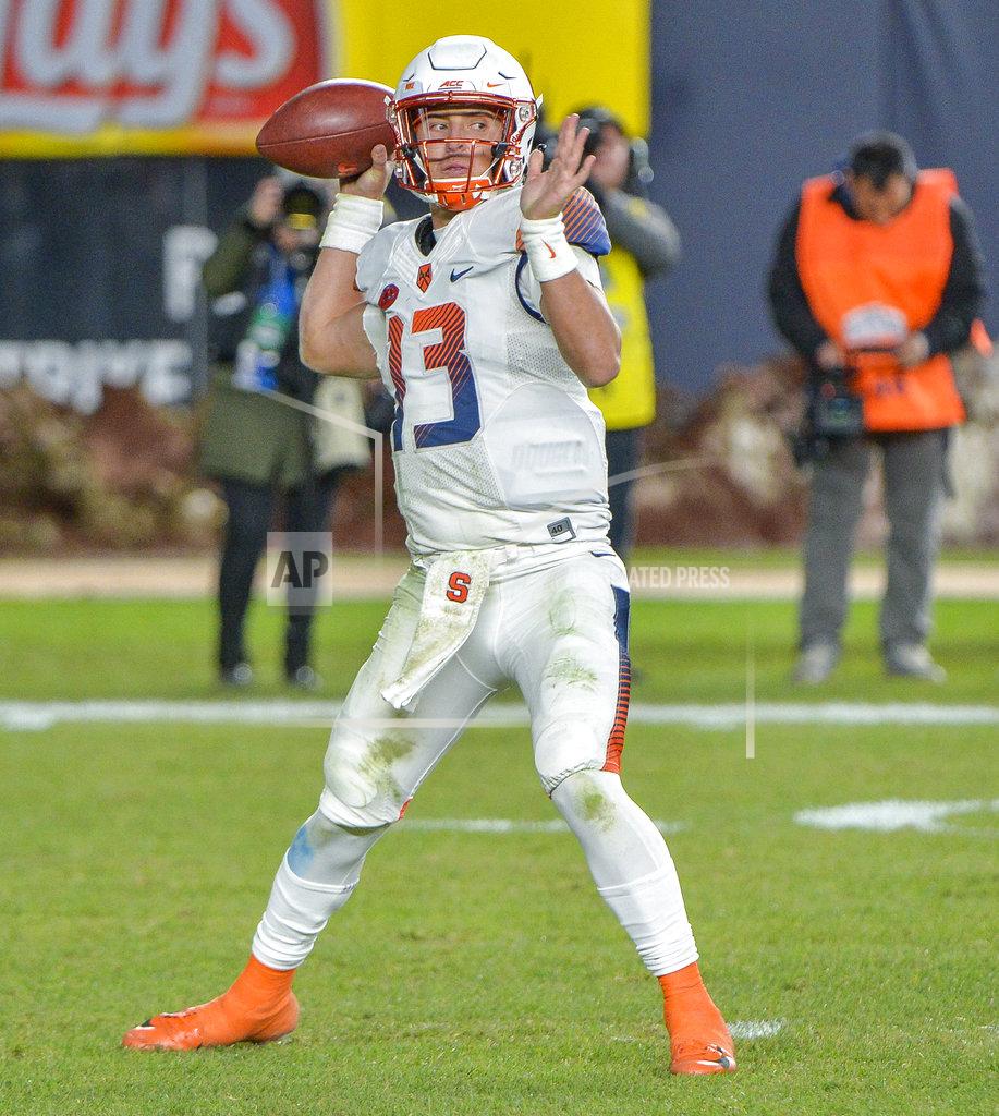Howard Simmons Syracuse quarterback Tommy DeVito (13) throws a pass during an NCAA college football game against Notre Dame, Saturday, Nov. 17, 2018, at Yankee Stadium in New York. (AP Photo/Howard Simmons)