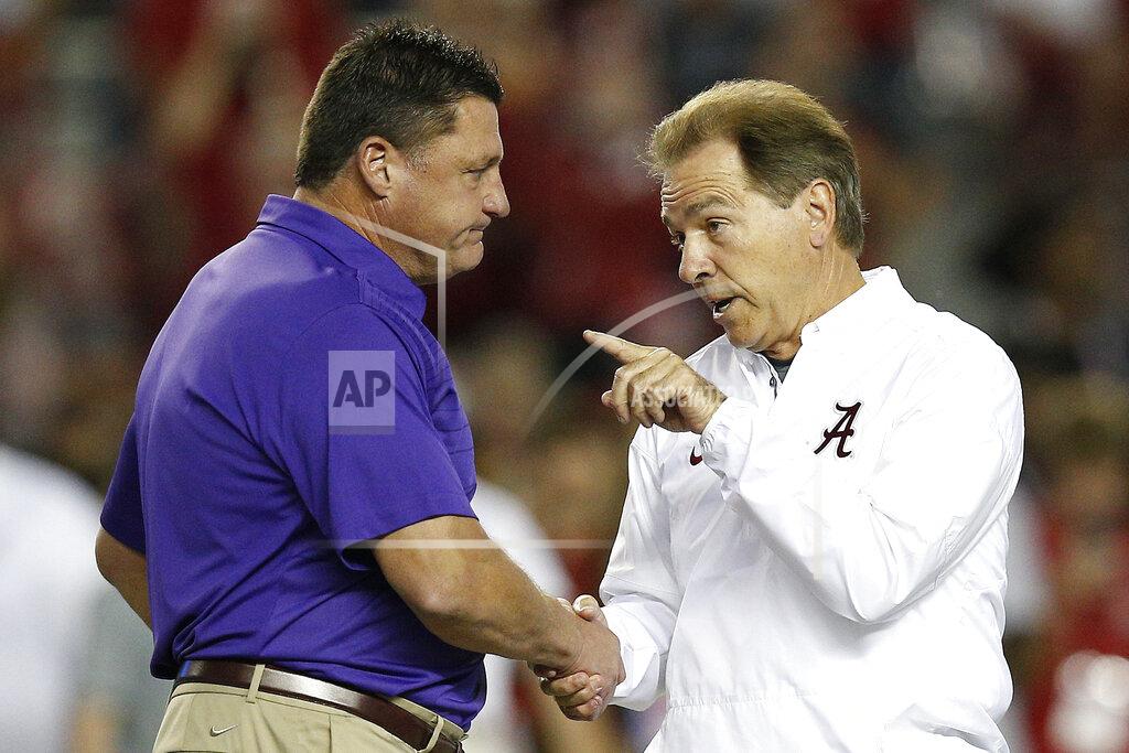 Brynn Anderson FILE - In this Nov. 4, 2017, file photo, LSU head coach Ed Orgeron, left, and Alabama head coach Nick Saban meet in the center of the field before an NCAA college football game, in Tuscaloosa, Ala. For the first time in college football history, there will be two games matching teams of at least 8-0 on the same day, according to ESPN Facts and Info. In Tuscaloosa, Alabama, LSU and the Crimson Tide will play the first regular-season game matching AP Nos. 1 and 2 since 2011 _ when No. 1 LSU beat No. 2 Alabama 9-6 in overtime. (AP Photo/Brynn Anderson, File)