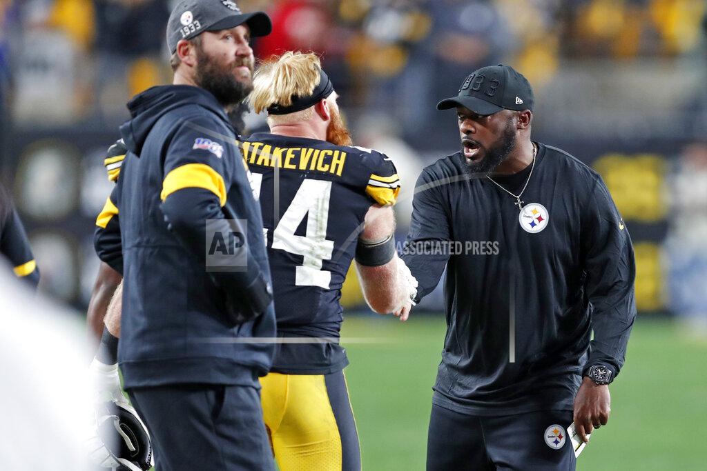Keith Srakocic Pittsburgh Steelers head coach Mike Tomlin, right, celebrates with inside linebacker Tyler Matakevich (44) as quarterback Ben Roethlisberger, left, looks at a replay on the scoreboard during the second half of an NFL football game against the Los Angeles Rams in Pittsburgh, Sunday, Nov. 10, 2019. (AP Photo/Keith Srakocic)