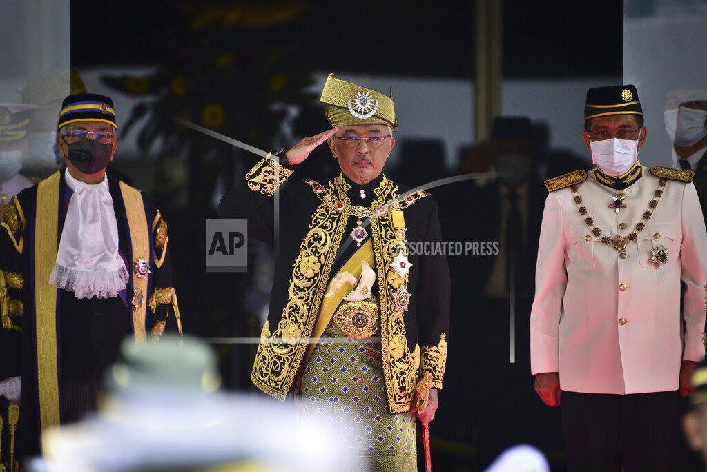 Shaiful Nizal Ismail In this photo released by Malaysia's Department of Information, Malaysia's King Sultan Abdullah Sultan Ahmad Shah, centre, salutes during the opening ceremony of the third term of the 14th parliamentary session at parliament house in Kuala Lumpur Monday, May 18, 2020. Malaysia's parliament held an unusual half-day sitting Monday, that was kept short due to the COVID-19 pandemic and saw Prime Minister Muhyiddin Yassin dodge a vote of no-confidence against him over two months since he came into power. (Shaiful Nizal Ismail/Malaysia's Department of Information via AP)