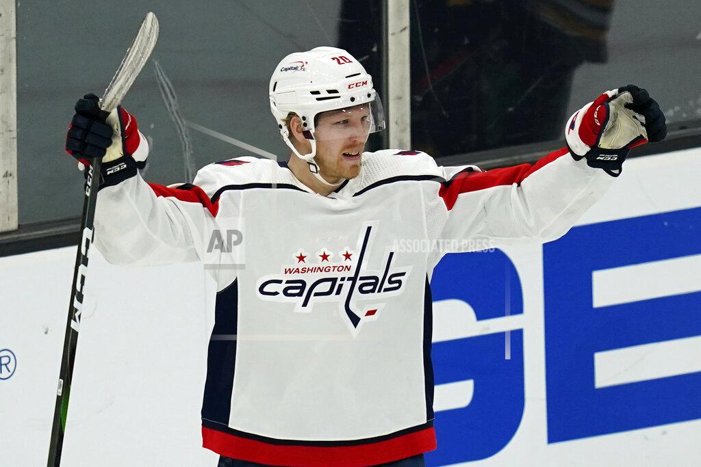 Charles Krupa Washington Capitals center Lars Eller (20) raises his arms after scoring against Boston Bruins goaltender Tuukka Rask during the third period of an NHL hockey game, Wednesday, March 3, 2021, in Boston. (AP Photo/Charles Krupa)