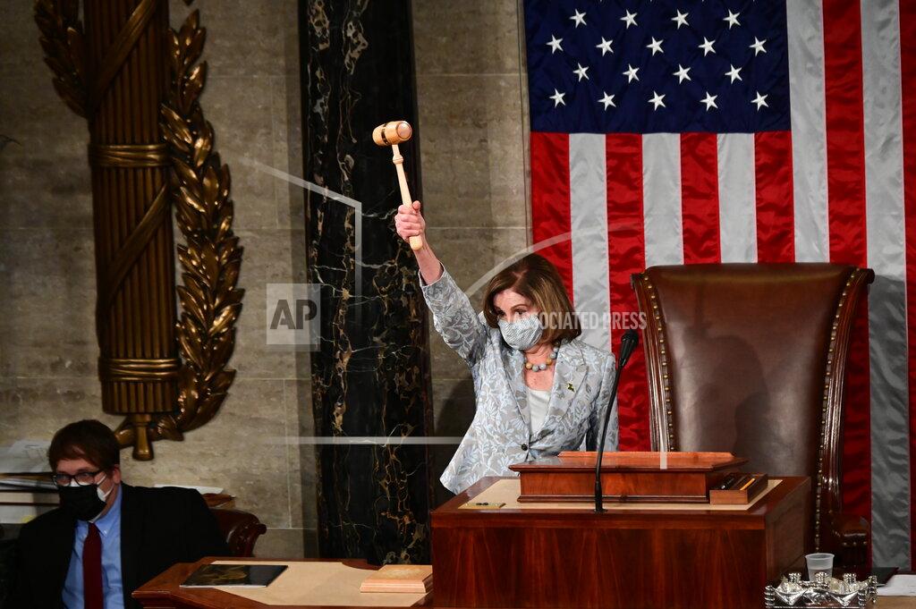 Erin Scott Speaker of the House Nancy Pelosi of Calif., waves the gavel on the opening day of the 117th Congress on Capitol Hill in Washington, Sunday, Jan. 3, 2021. (Erin Scott/Pool via AP)