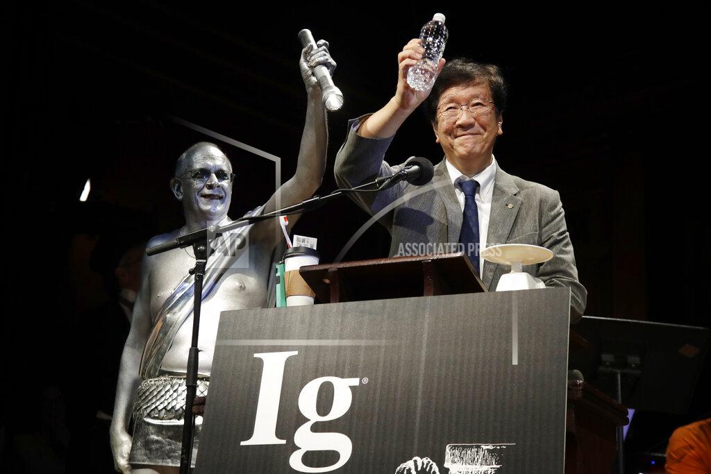 Elise Amendola FILE - In this Sept. 12, 2019 file photo, Shigeru Watanabe, of Japan, receives the Ig Nobel award in chemistry for estimating the total saliva volume produced per day by a typical five-year-old, at the 29th annual Ig Nobel awards ceremony at Harvard University, in Cambridge, Mass. The spoof prizes for weird and sometimes head-scratching scientific achievement will be presented online in 2021 due to the coronavirus pandemic. (AP Photo/Elise Amendola, File)