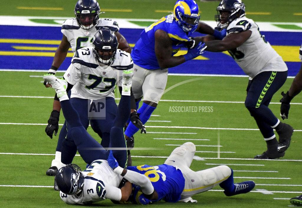 Keith Birmingham Defensive end Michael Brockers #90 of the Los Angeles Rams sacks quarterback Russell Wilson #3 of the Seattle Seahawks in the fourth quarter of a NFL football game at SoFi Stadium in Inglewood on Sunday, November 15, 2020. Los Angeles Rams won 23-16. (Keith Birmingham/The Orange County Register via AP)