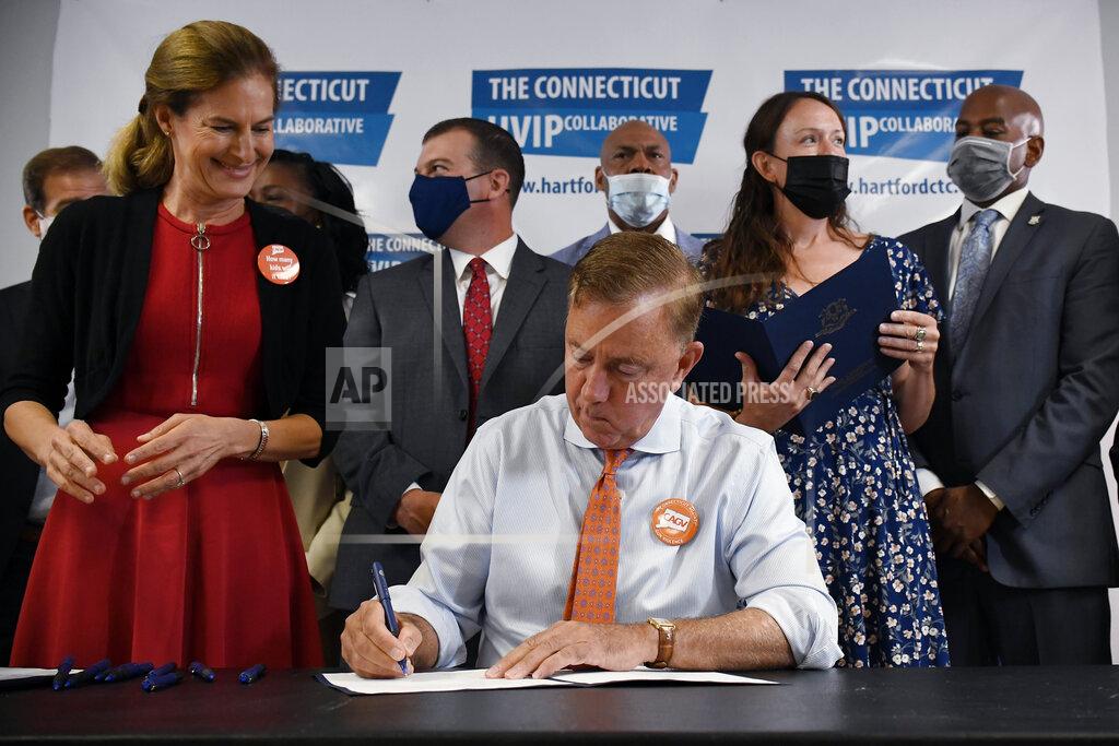 Jessica Hill Connecticut Gov. Ned Lamont signs a ceremonial bill on gun safety at Hartford Communities That Care, Tuesday, July 27, 2021 in Hartford, Conn. (AP Photo/Jessica Hill)