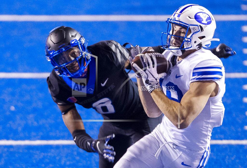 Darin Oswald BYU wide receiver Gunner Romney secures a pass from quarterback Zach Wilson (1) defended by Boise State cornerback Markel Reed (8) Friday, Nov. 6, 2020, at the Albertsons Stadium in Boise, Idaho. (Darin Oswald/Idaho Statesman via AP)