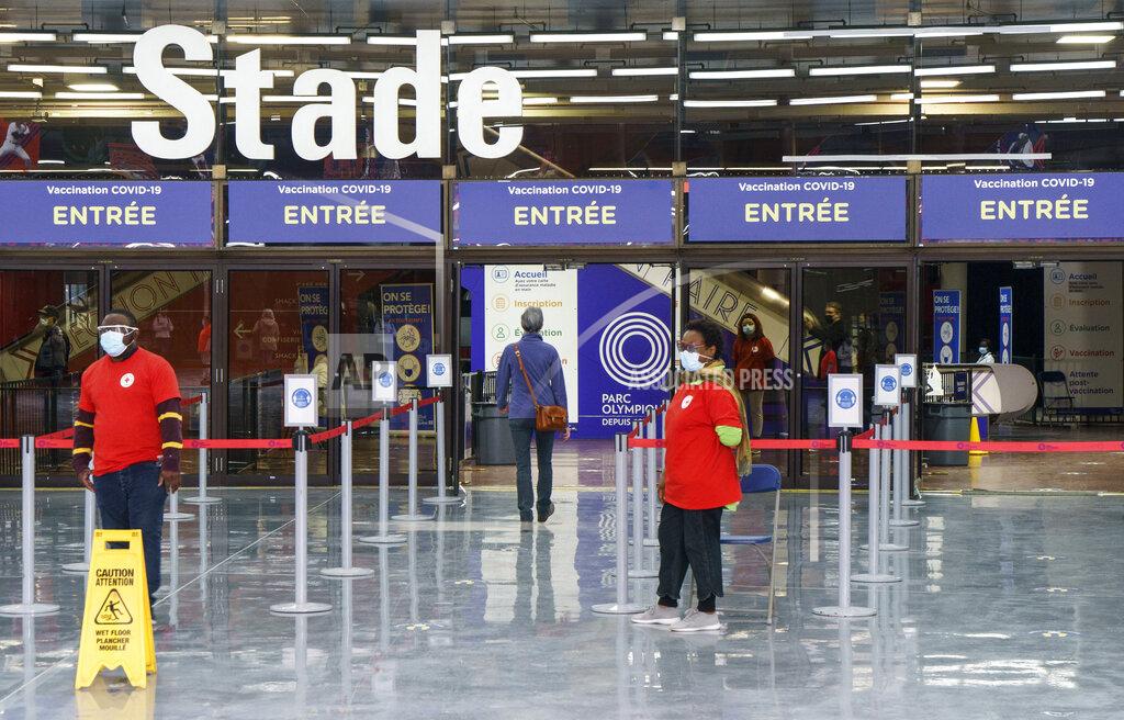 Paul Chiasson A lone patient enters a COVID-19 vaccination clinic during the coronavirus pandemic at Olympic Stadium in Montreal, on Wednesday, April 7, 2021. (Paul Chiasson/The Canadian Press via AP)