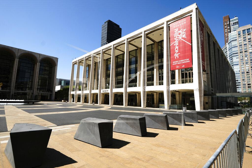 Evan Agostini FILE - This May 12, 2020 file photo shows David Geffen Hall at Lincoln Center, closed during COVID-19 lockdown, in New York. The New York Philharmonic canceled its fall season because of the coronavirus pandemic. (Photo by Evan Agostini/Invision/AP, File)