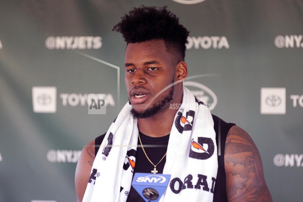 FILE - In this Thursday, July 25, 2019, file photo, New York Jets tight end Chris Herndon speaks to reporters after a practice at the NFL football team's training camp in Florham Park, N.J. Herndon's first five games have been filled with drops, diminished playing time and doubts. (AP Photo/Seth Wenig, File)