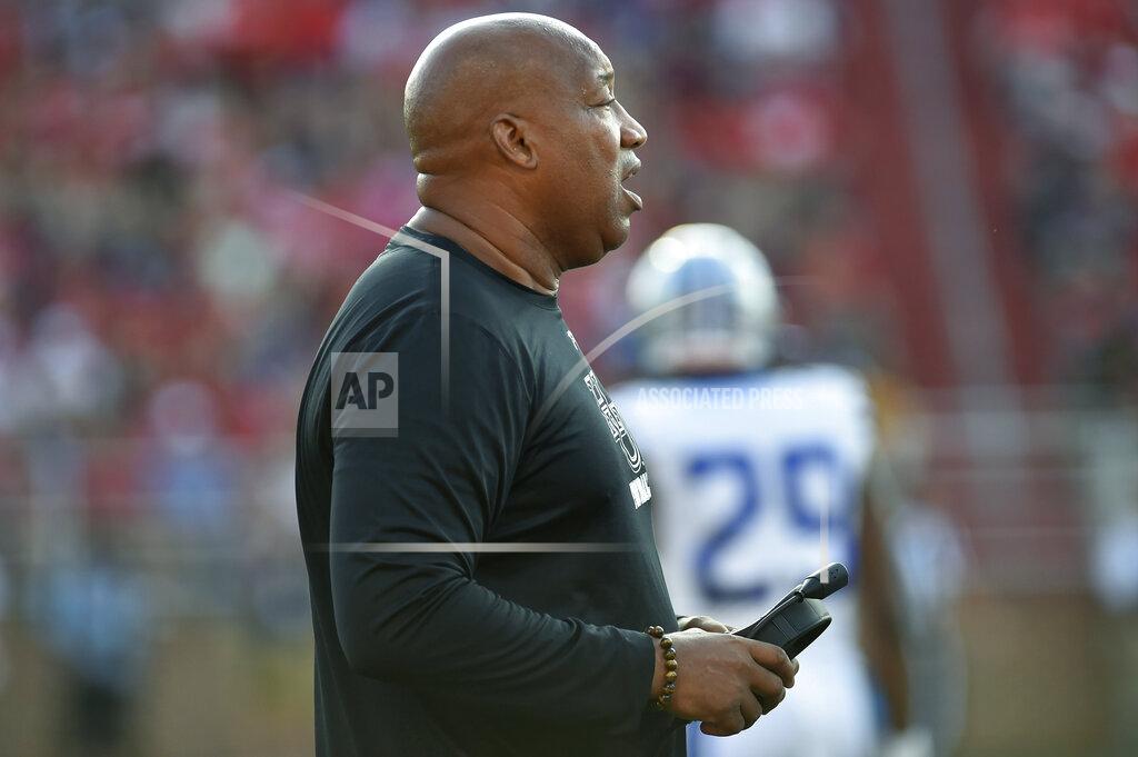 Taylor Irby Hampton coach Robert Prunty watches the team' college football game against Liberty in Lynchburg, Va., Saturday, Sept. 21, 2019. (Taylor Irby/The News & Advance via AP)