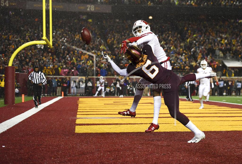 Aaron Lavinsky Wisconsin cornerback Caesar Williams (21) breaks up a pass intended for Minnesota wide receiver Tyler Johnson (6) during the second half of an NCAA college football game Saturday, Nov. 30, 2019, in Minneapolis. (Aaron Lavinsky/Star Tribune via AP)