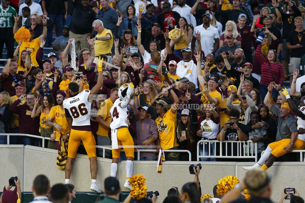 Al Goldis Arizona State players celebrate with fans following an NCAA college football game against Michigan State, Saturday, Sept. 14, 2019, in East Lansing, Mich. (AP Photo/Al Goldis)