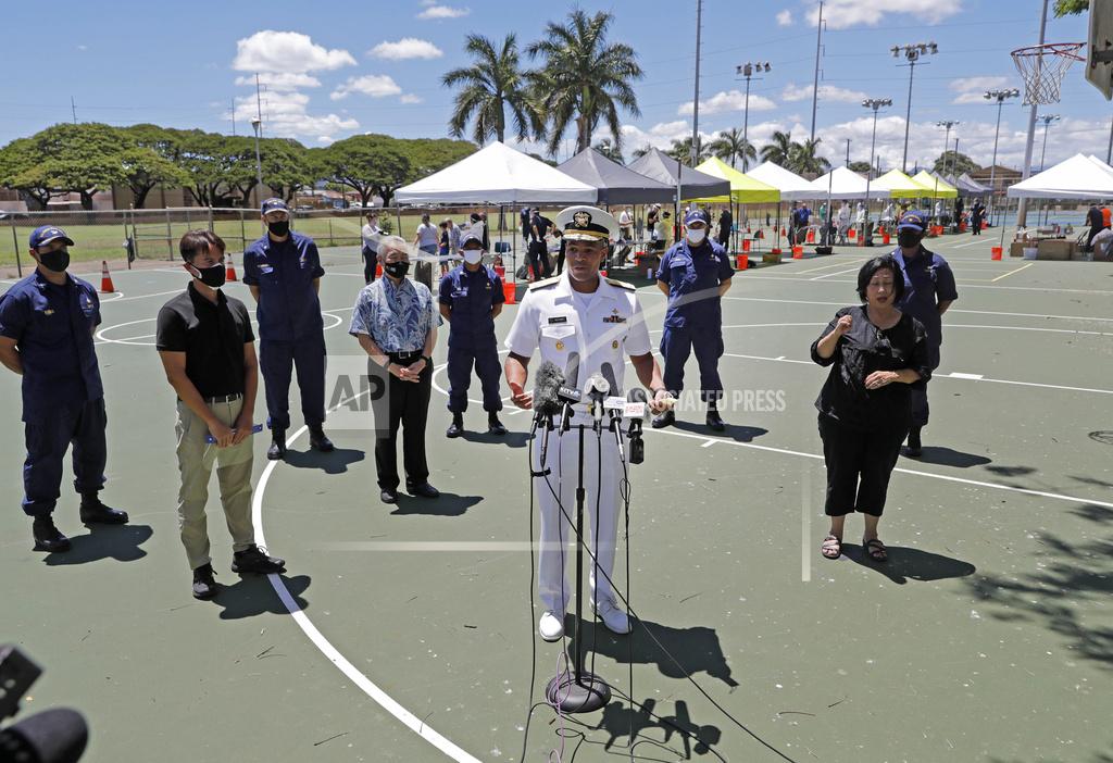 FILE - In this Aug. 27, 2020, file photo, U.S. Surgeon General Jerome Adams speaks during a press conference on the second day of surge COVID-19 testing, at Kalakaua District Park in Honolulu. A lawyer for Surgeon General Adams pleaded not guilty Monday, Nov. 2, 2020, on behalf of Adams who was cited by Honolulu police for being in a closed park during a trip to help Hawaii cope with a spike in coronavirus cases. Adams didn't travel to Hawaii for the arraignment. (Jamm Aquino/Honolulu Star-Advertiser via AP, File)