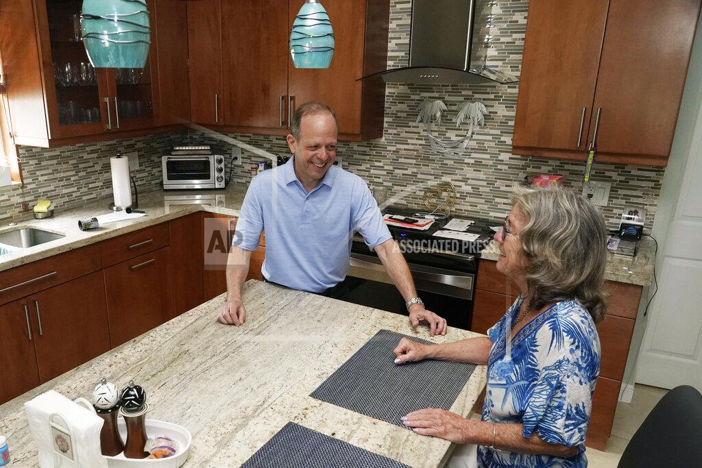 Marta Lavandier Mark Bendell and his wife Laurie talk in their kitchen, Monday, May 23, 2022, in Boca Raton, Fla. A stock market slump this year, which has taken big bites out of investors’ portfolios, including retirement plans like 401(k)s, is worrying Americans who are within a few years of retirement. (AP Photo/Marta Lavandier)