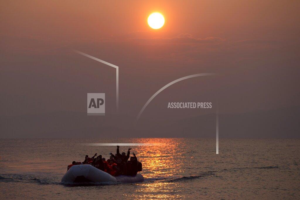 Petros Giannakouris FILE - In this Sunday, March 20, 2016 file photo, the sun rises as migrants and refugees on a dinghy arrive at the shore of the northeastern Greek island of Lesbos, after crossing the Aegean sea from Turkey. Five years on, the deal between European Union and Turkey is no longer working but at a summit next week EU leaders will discuss ways to improve relations with Turkey and could try to revive the agreement. (AP Photo/Petros Giannakouris, File)