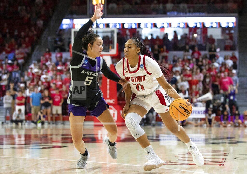 Ben Mckeown North Carolina State's Jakia Brown-Turner (11) handles the ball as Kansas State's Brylee Glenn (5) defends during the second half of a college basketball game in the second round of the NCAA tournament in Raleigh, N.C., Monday, March 21, 2022. (AP Photo/Ben McKeown)