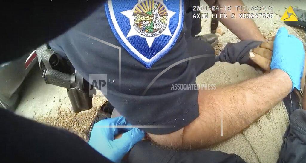Uncredited In this image taken from Alameda Police Department body camera video, Alameda Police Department officers pin 26-year-old Mario Gonzalez to the ground during an arrest, April 19, 2021, in Alameda, Calif. Gonzalez stopped breathing during the arrest and was pronounced dead at a hospital. (Alameda Police Department via AP)