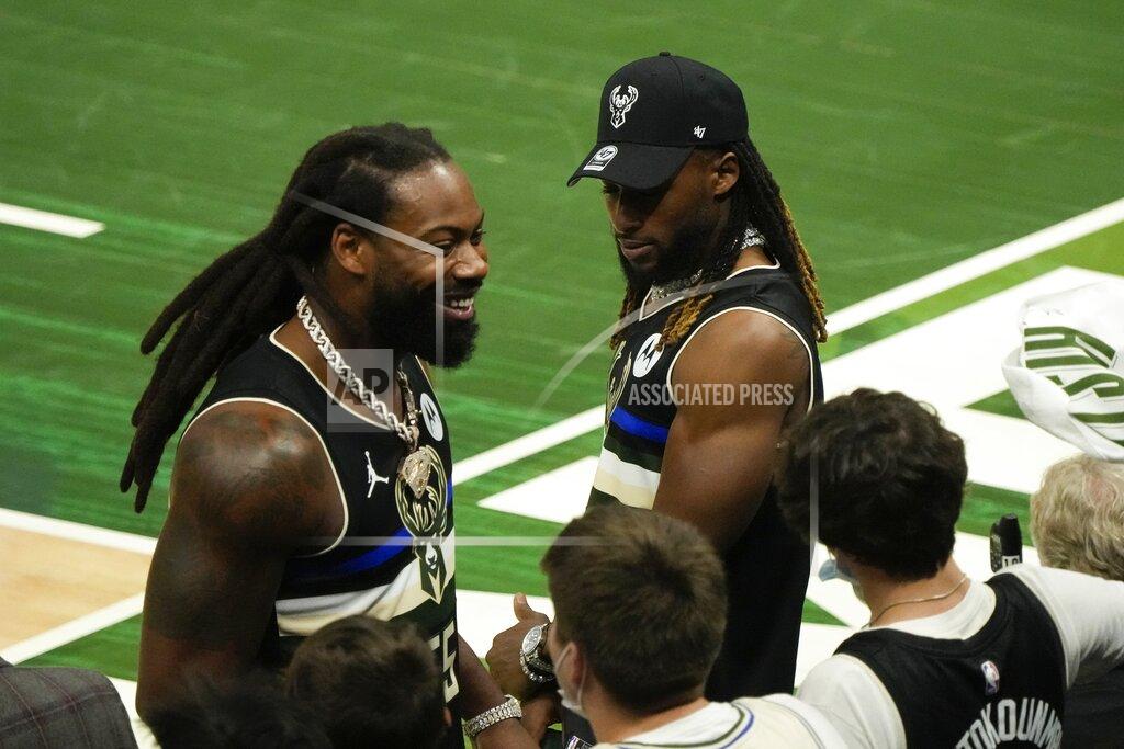 Morry Gash Green Bay Packers Za'Darius Smith and Aaron Jones have some fun during the second half of Game 3 of the NBA Eastern Conference basketball semifinals game between the Milwaukee Bucks and the Brooklyn NetsThursday, June 10, 2021, in Milwaukee. The Bucks won 86-83 and the Nets lead the series 2-1. (AP Photo/Morry Gash)