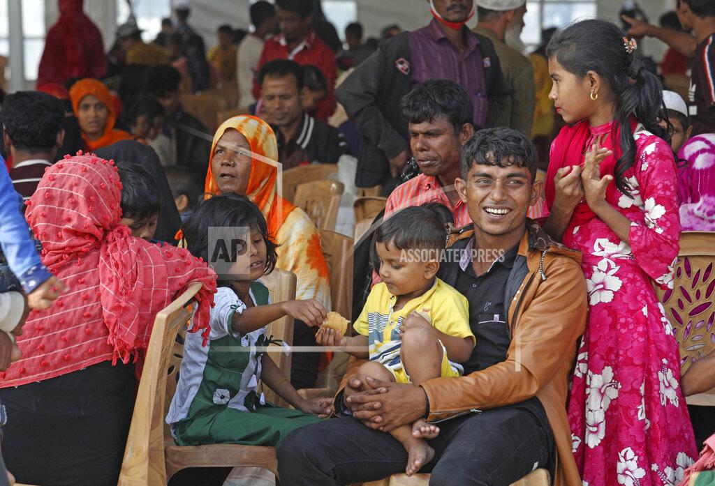 Uncredited Rohingya refugees wait to be transported on a naval vessel to Bhashan Char, or floating island, in the Bay of Bengal, from Chittagong, Bangladesh, Friday, Dec. 4, 2020. Authorities in Bangladesh on Friday started sending a first group of nearly more than 1,500 Rohingya refugees to an isolated island despite calls by human rights groups for a halt to the process. (AP Photo).