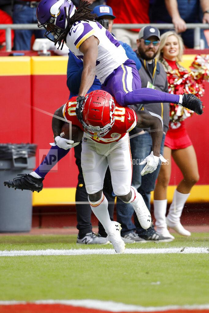 Colin E. Braley Minnesota Vikings cornerback Trae Waynes (26) vaults over Kansas City Chiefs wide receiver Tyreek Hill (10), after Hill scored a touchdown on a 40-yard pass by quarterback Matt Moore (8), during the first half of an NFL football game in Kansas City, Mo., Sunday, Nov. 3, 2019. (AP Photo/Colin E. Braley)