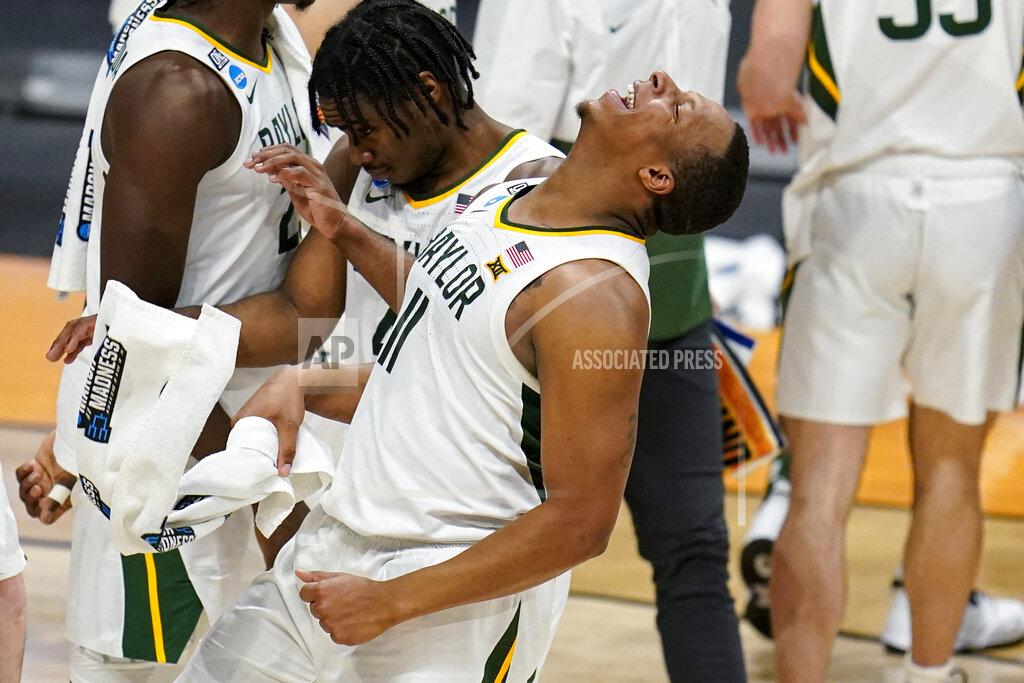 Michael Conroy Baylor guard Mark Vital (11) celebrates after a 76-63 win over Wisconsin in a second-round game in the NCAA men's college basketball tournament at Hinkle Fieldhouse in Indianapolis, Sunday, March 21, 2021. (AP Photo/Michael Conroy)