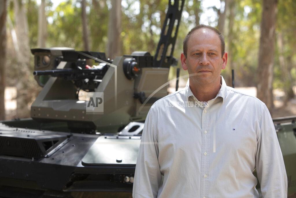 Sebastian Scheiner Deputy head of Israel Aerospace Industries autonomous systems division, Rani Avni, speaks during an interview with The Associated Press in an IAI facility near the central Israeli city of Lod, Thursday, Sept. 9, 2021. Israel's state-owned Israel Aerospace Industries unveiled Monday a state-of-the-art unmanned vehicle their specialists said will be deployed alongside ground troops to assist in combat situations. (AP Photo/Sebastian Scheiner)