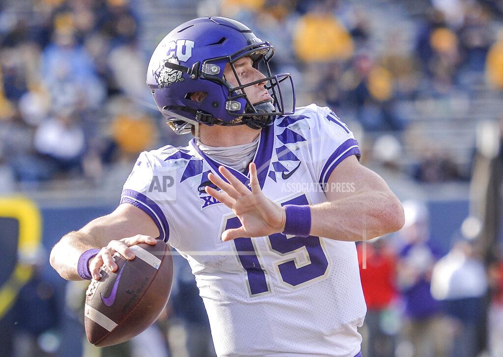 William Wotring TCU quarterback Max Duggan (15) makes a pass against West Virginia during the second half of an NCAA college football game on Saturday, Nov. 14, 2020, in Morgantown, W.Va. (William Wotring/The Dominion-Post via AP)