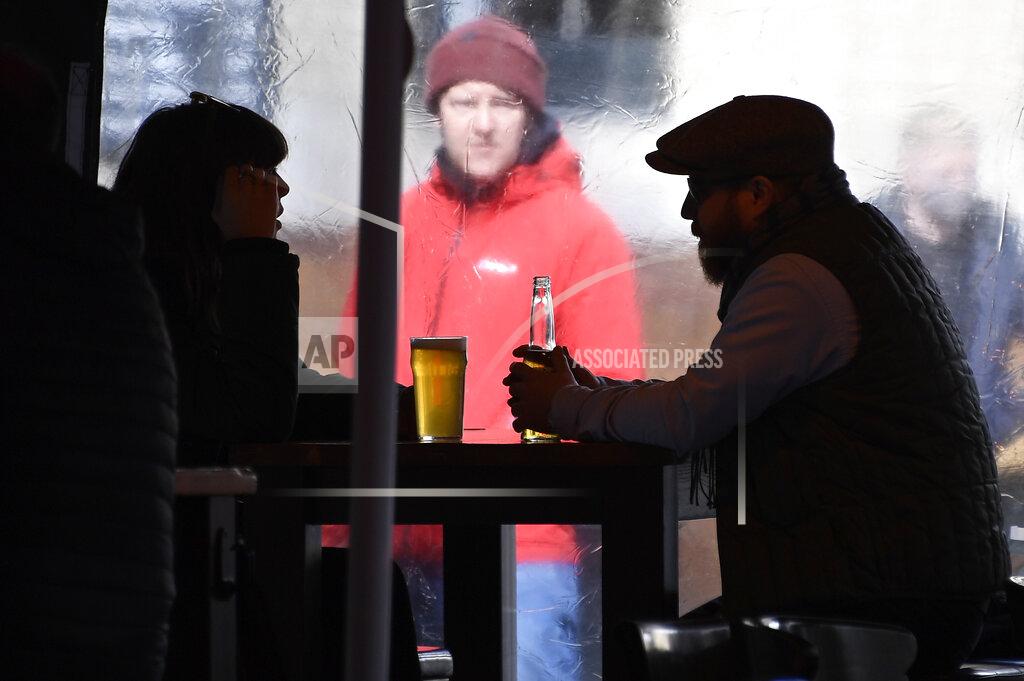 Alberto Pezzali People enjoy a drink at Borough Market in London, Monday, April 12, 2021. Millions of people in England will get their first chance in months for haircuts, casual shopping and restaurant meals on Monday, as the government takes the next step on its lockdown-lifting road map. (AP Photo/Alberto Pezzali)