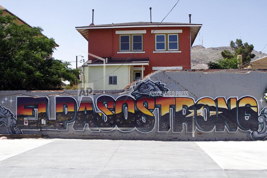 Cedar Attanasio This May 7, 2020 photo shows an "El Paso Strong" mural painted in the wake of the Aug. 3, 2019 shooting by artists Gabe Vasquez and Justin Martinez in El Paso, Texas. The star painted in the mural's letters can be seen at night in the Franklin Mountains in the background.(AP Photo/Cedar Attanasio)