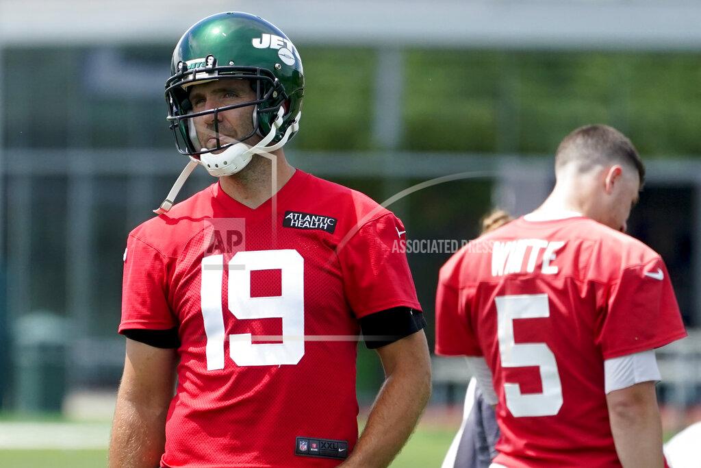 FILE - New York Jets quarterback Joe Flacco takes part in drills at the NFL football team's practice facility, Tuesday, June 14, 2022, in Florham Park, N.J. There are moments — and they seem to be increasing — when Joe Flacco knows his teammates are laughing at him. Not for anything he's doing on the field. But the New York Jets quarterback is 37 years old — and that's downright ancient when you consider he's on a roster filled with guys who were still learning how to add, subtract and read when he was starting his NFL career. (AP Photo/John Minchillo, File)