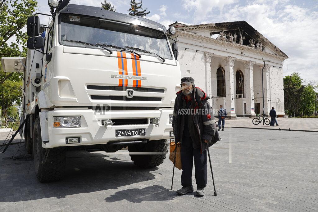 Alexei Alexandrov A man walks next to a theater building that has been bombed, in Mariupol, in territory under the government of the Donetsk People's Republic, eastern Ukraine, Saturday, May 21, 2022. (AP Photo/Alexei Alexandrov)