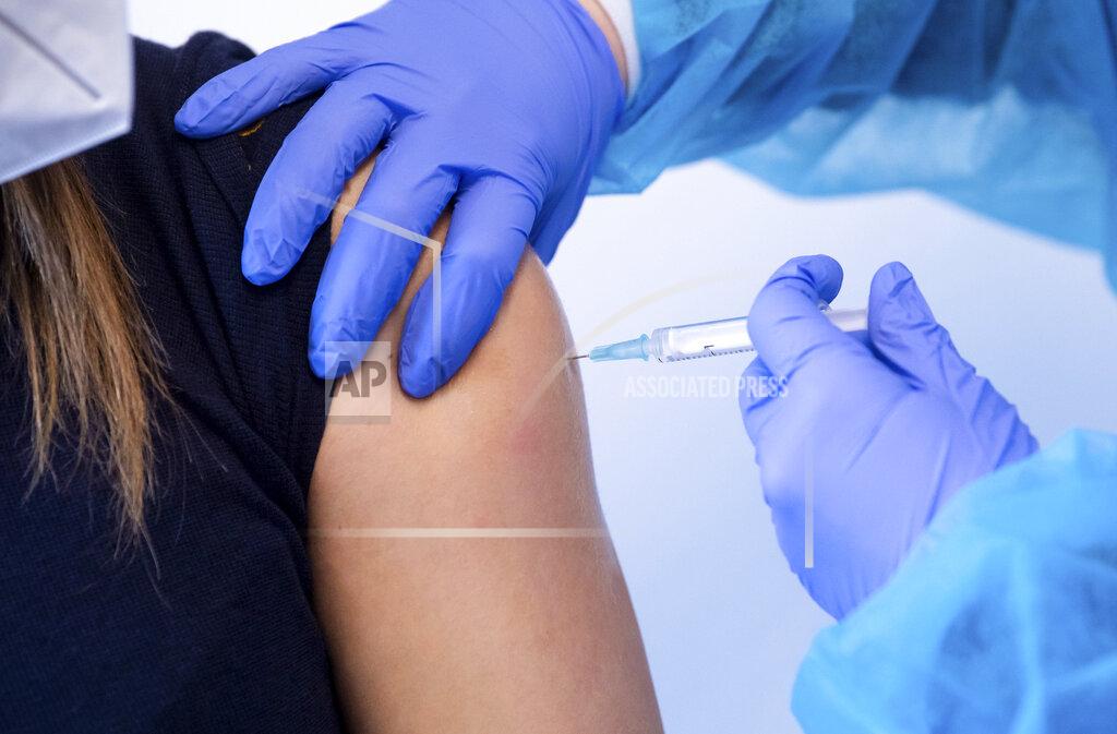 Sven Hoppe FILE - In this March 2, 2021, file photo, a police officer receives an injection with AstraZeneca's COVID-19 vaccine in Munich, Germany. After saying last week they would continue with the vaccine, German officials said Monday, March 15, they would suspend its use after new reports of problems, based on the advice from its medicines regulator. (Sven Hoppe/dpa via AP, File)