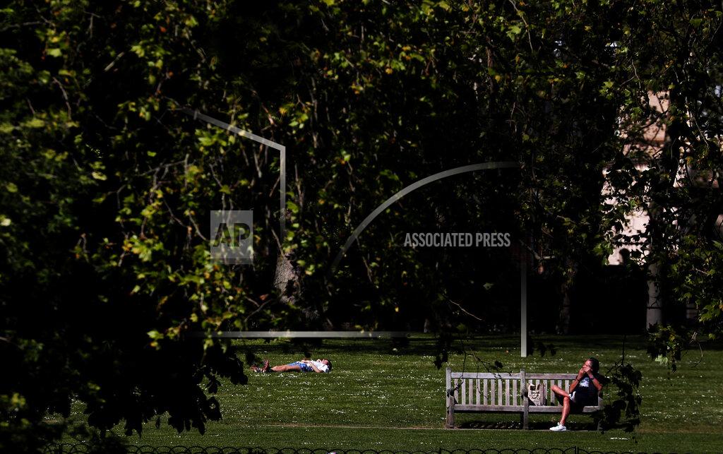Frank Augstein People obey social distancing in a park in London, Wednesday April 22, 2020 as the lockdown in Britain continues due to the coronvirus pandemic. (AP Photo/Frank Augstein)