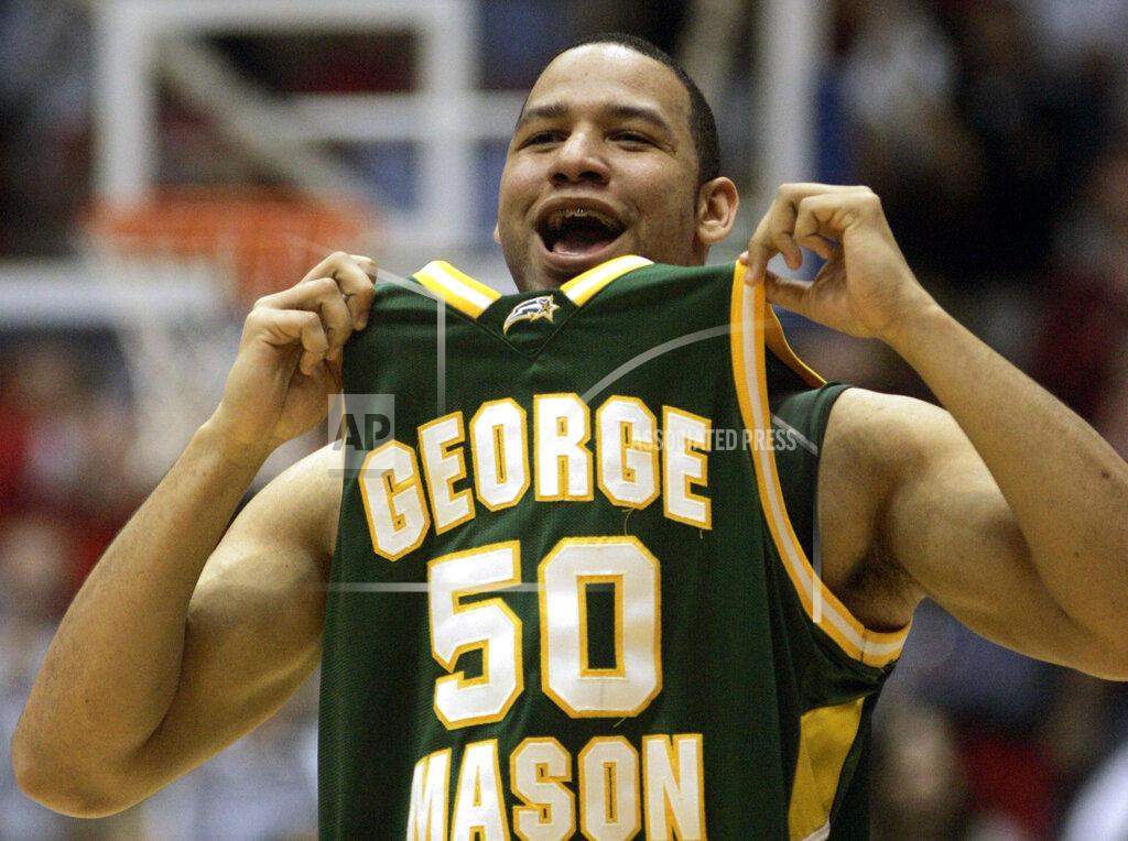 Al Behrman FILE - In this March 19, 2006, file photo, George Mason forward Sammy Hernandez (50) celebrates as George Mason beat North Carolina in the NCAA second-round men's basketball game in Dayton, Ohio. No one saw a Final Four run coming after the team that lost in the Colonial Athletic Association semifinals. George Mason beat Michigan State, North Carolina and Wichita State before taking down No. 1 seed Connecticut and its roster full of NBA talent, 86-84 in overtime. They lost 73-58 to eventual national champion Florida in the semifinals.(AP Photo/Al Behrman, File)