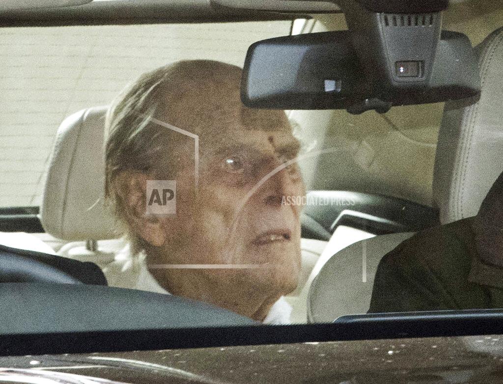 Stefan Rousseau Britain's Prince Philip as he leaves the King Edward VII hospital in the back of a car in London, Tuesday, March 16, 2021. The 99-year-old husband of Queen Elizabeth II has been hospitalized after a heart procedure. (Stefan Rousseau/PA via AP)