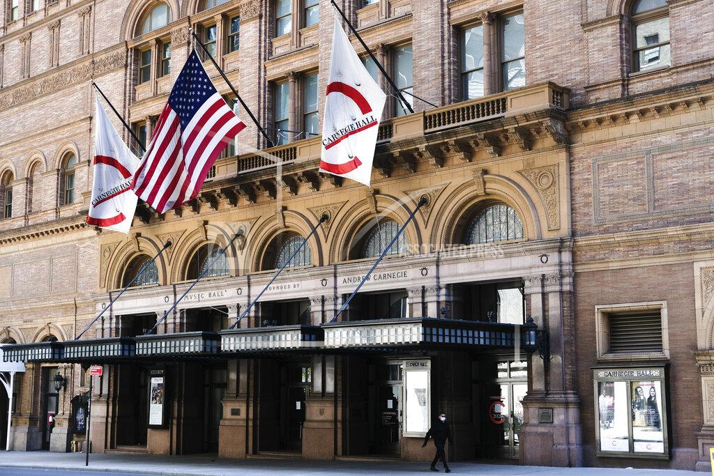 FILE - This May 12, 2020 file photo shows Carnegie Hall in New York. Carnegie Hall will miss an entire season for the first time for the first time in its 130-year history. Carnegie canceled performances from April 6 through July at its three venues, extending a closure that started last March 13 due to the novel coronavirus pandemic. (Photo by Evan Agostini/Invision/AP, File)