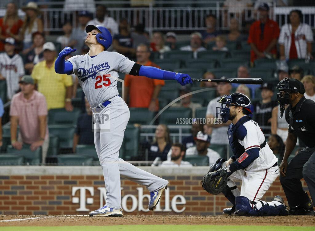 Bob Andres Los Angeles Dodgers' Trayce Thompson hits a two RBI single during the ninth inning of a baseball game against the Atlanta Braves, won by the Los Angeles Dodgers 5-3 on Sunday, June 26, 2022, in Atlanta. (AP Photo/Bob Andres)