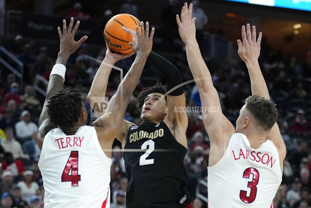 John Locher Colorado's KJ Simpson (2) shoots against Arizona's Dalen Terry (4) and Arizona's Pelle Larsson (3) during the second half of an NCAA college basketball game in the semifinal round of the Pac-12 tournament Friday, March 11, 2022, in Las Vegas. (AP Photo/John Locher)
