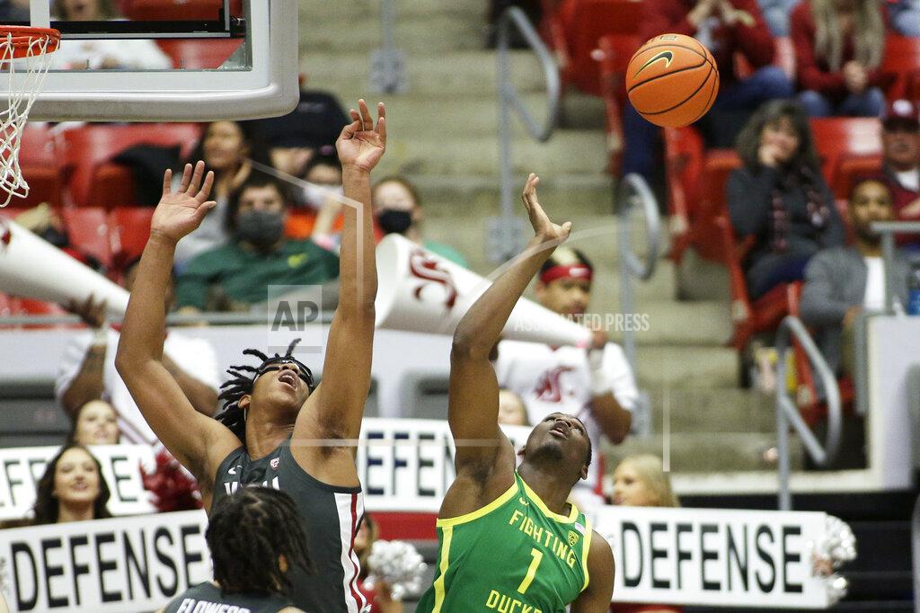 Young Kwak Washington State center Dishon Jackson, left, and Oregon center N'Faly Dante go after a rebound during the second half of an NCAA college basketball game, Saturday, March 5, 2022, in Pullman, Wash. Washington State won 94-74. (AP Photo/Young Kwak)