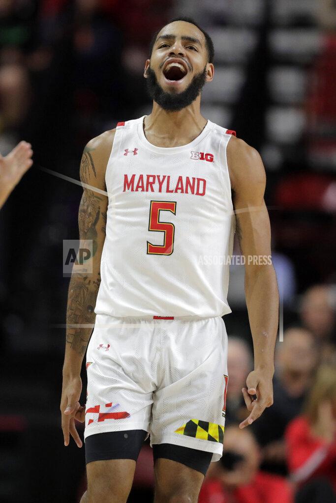 Julio Cortez Maryland guard Eric Ayala reacts after scoring a shot against Holy Cross during the second half of an NCAA college basketball game, Tuesday, Nov. 5, 2019, in College Park, Md. Maryland won 95-71. (AP Photo/Julio Cortez)
