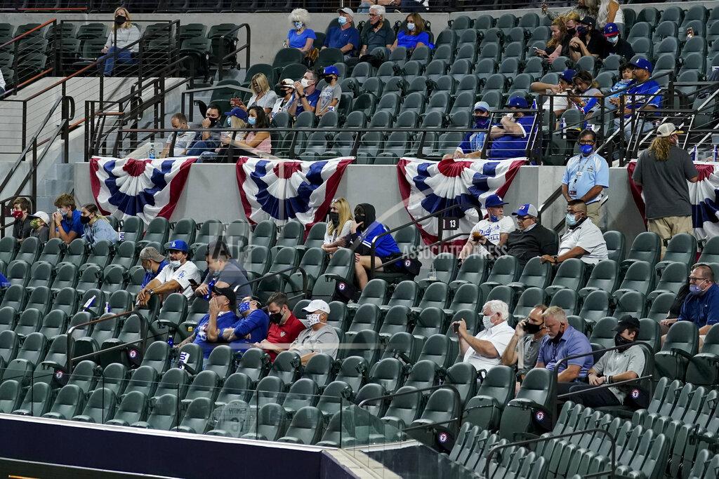 Tony Gutierrez Fans watch during the second inning in Game 1 of a baseball National League Championship Series between the Los Angeles Dodgers and the Atlanta Braves Monday, Oct. 12, 2020, in Arlington, Texas. (AP Photo/Tony Gutierrez)
