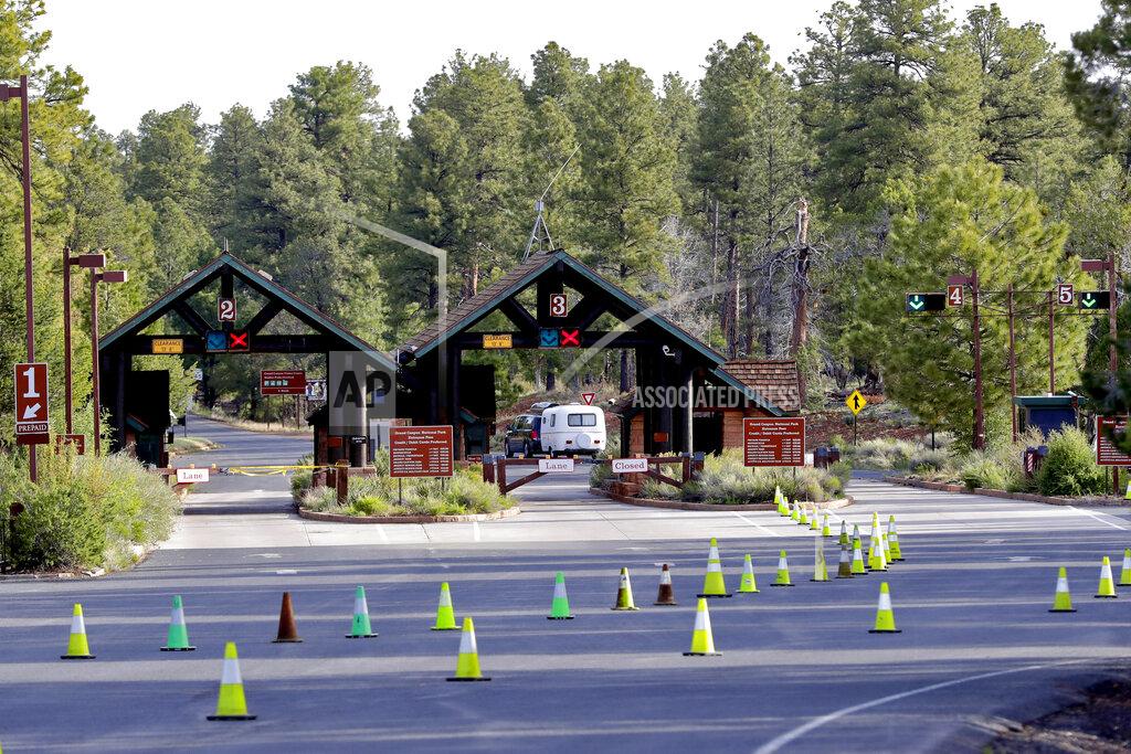 Matt York Guests arrive at the Grand Canyon Friday, May 15, 2020, in Grand Canyon, Ariz. Tourists are once again roaming portions of Grand Canyon National Park when it partially reopened Friday morning, despite objections that the action could exacerbate the coronavirus pandemic. (AP Photo/Matt York)