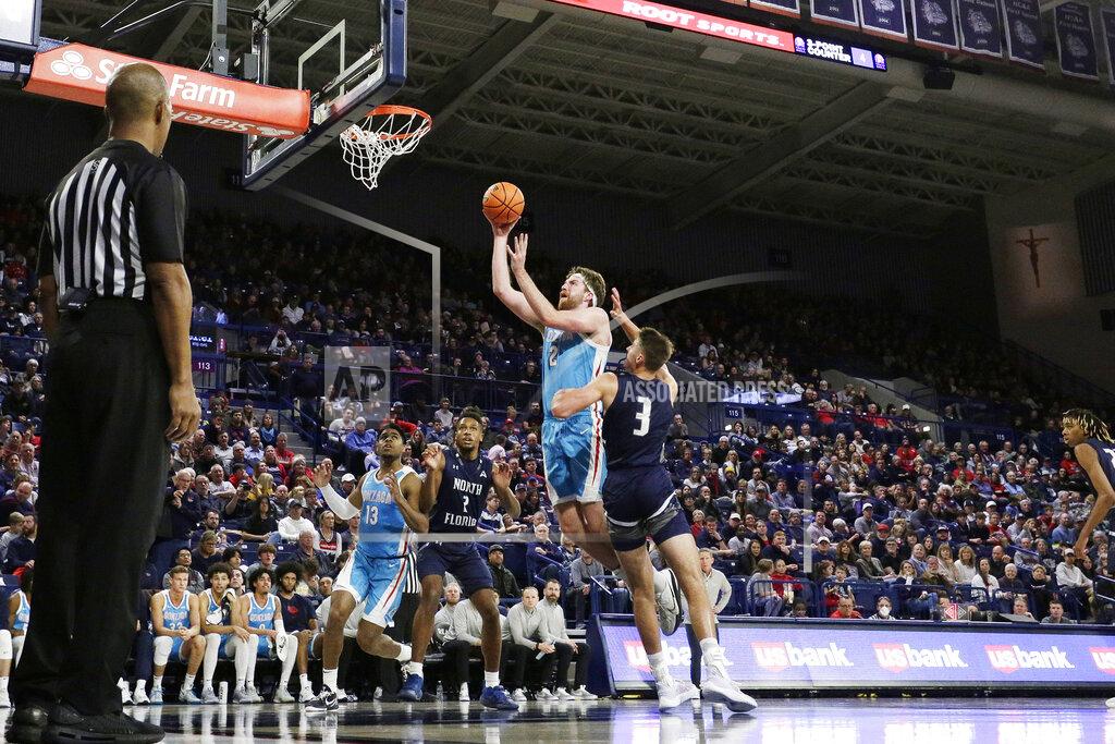 Young Kwak Gonzaga forward Drew Timme (2) shoots while defended by North Florida forward Carter Hendricksen (3) during the second half of an NCAA college basketball game, Monday, Nov. 7, 2022, in Spokane, Wash. Gonzaga won 104-63. (AP Photo/Young Kwak)