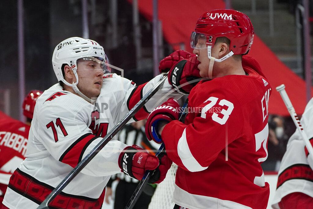 Paul Sancya Carolina Hurricanes right wing Jesper Fast (71) and Detroit Red Wings left wing Adam Erne (73) battle in the second period of an NHL hockey game Thursday, Jan. 14, 2021, in Detroit. (AP Photo/Paul Sancya)