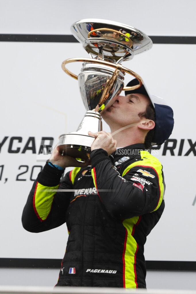 Michael Conroy Simon Pagenaud, of France, celebrates after winning the Indy GP IndyCar auto race at Indianapolis Motor Speedway, Saturday, May 11, 2019, in Indianapolis. (AP Photo/Michael Conroy)